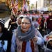 Dorene Day, an Ojibwe, sings the American Indian Movement theme song during a march with a coalition of tribal nations, Native American organizers, an