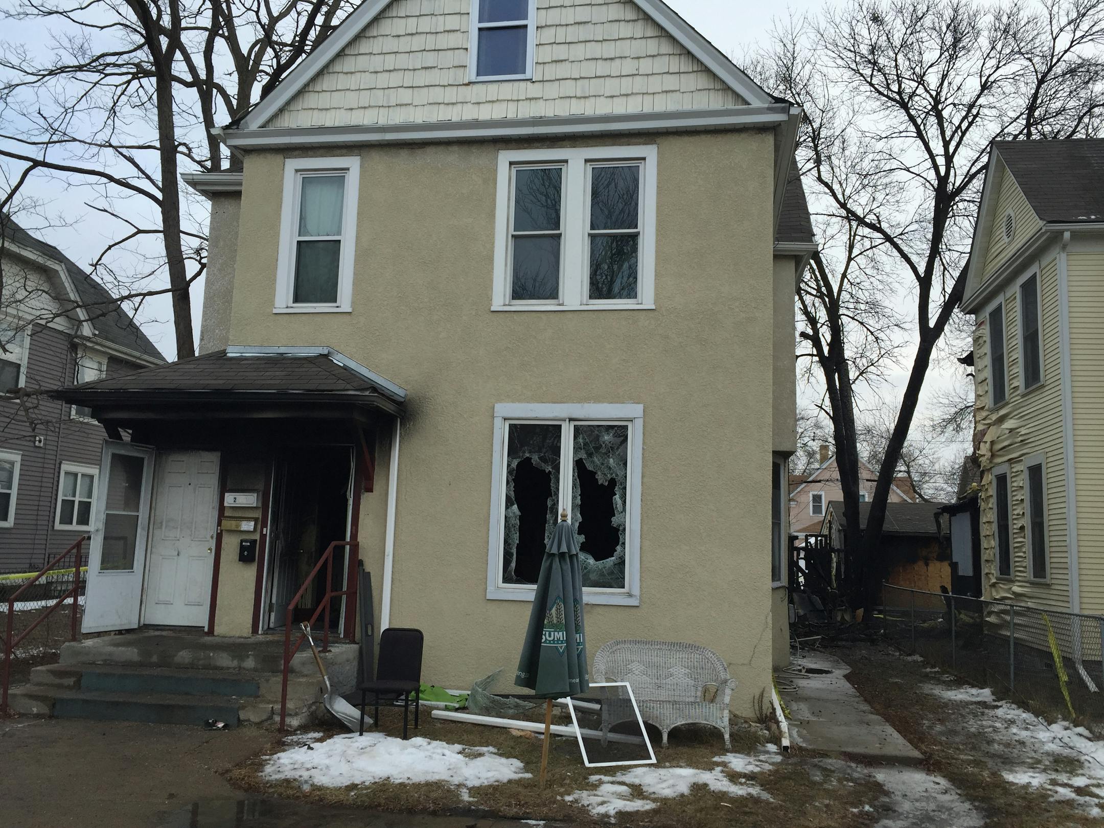 Fire ravaged one home and jumped to another in the 3400 block of Chicago Avenue early Sunday. One person died.