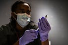 A nurse prepared a Covid-19 vaccine booster in Washington, Feb. 4, 2022. 