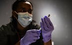 A nurse prepared a Covid-19 vaccine booster in Washington, Feb. 4, 2022. 
