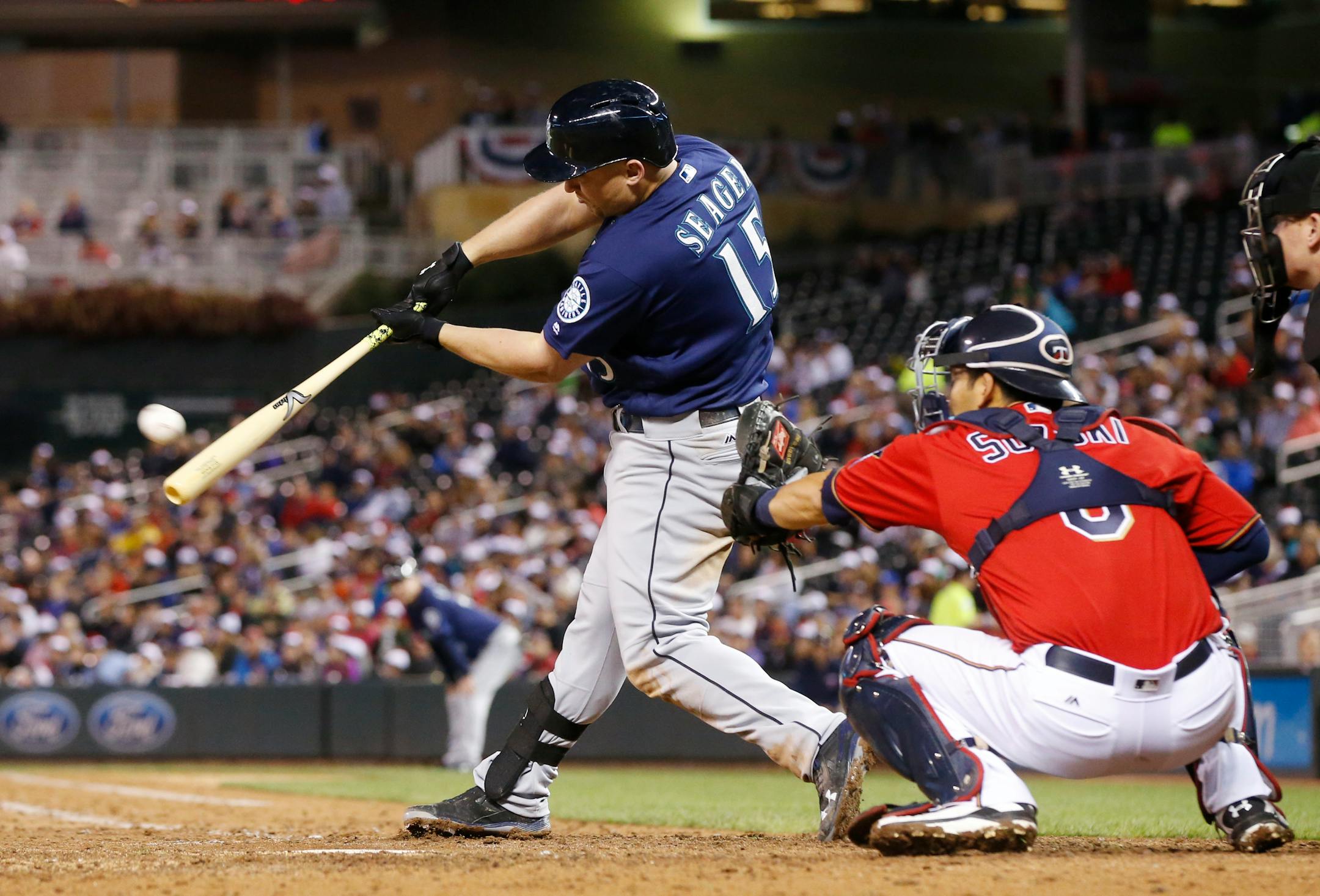 Seattle Mariners' Kyle Seager hits an RBI double off Minnesota Twins pitcher Buddy Boshers during the seventh inning of a baseball game Friday, Sept. 23, 2016, in Minneapolis. (AP Photo/Jim Mone)