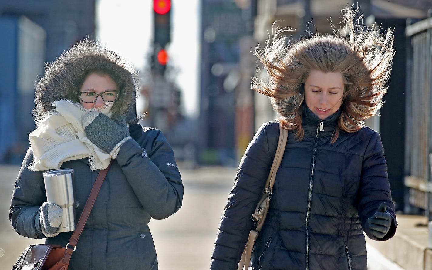 Kat Gritsenko, left, and Robin Turnblom walked to work at the State Capitol from downtown St. Paul on Wednesday morning despite high winds.