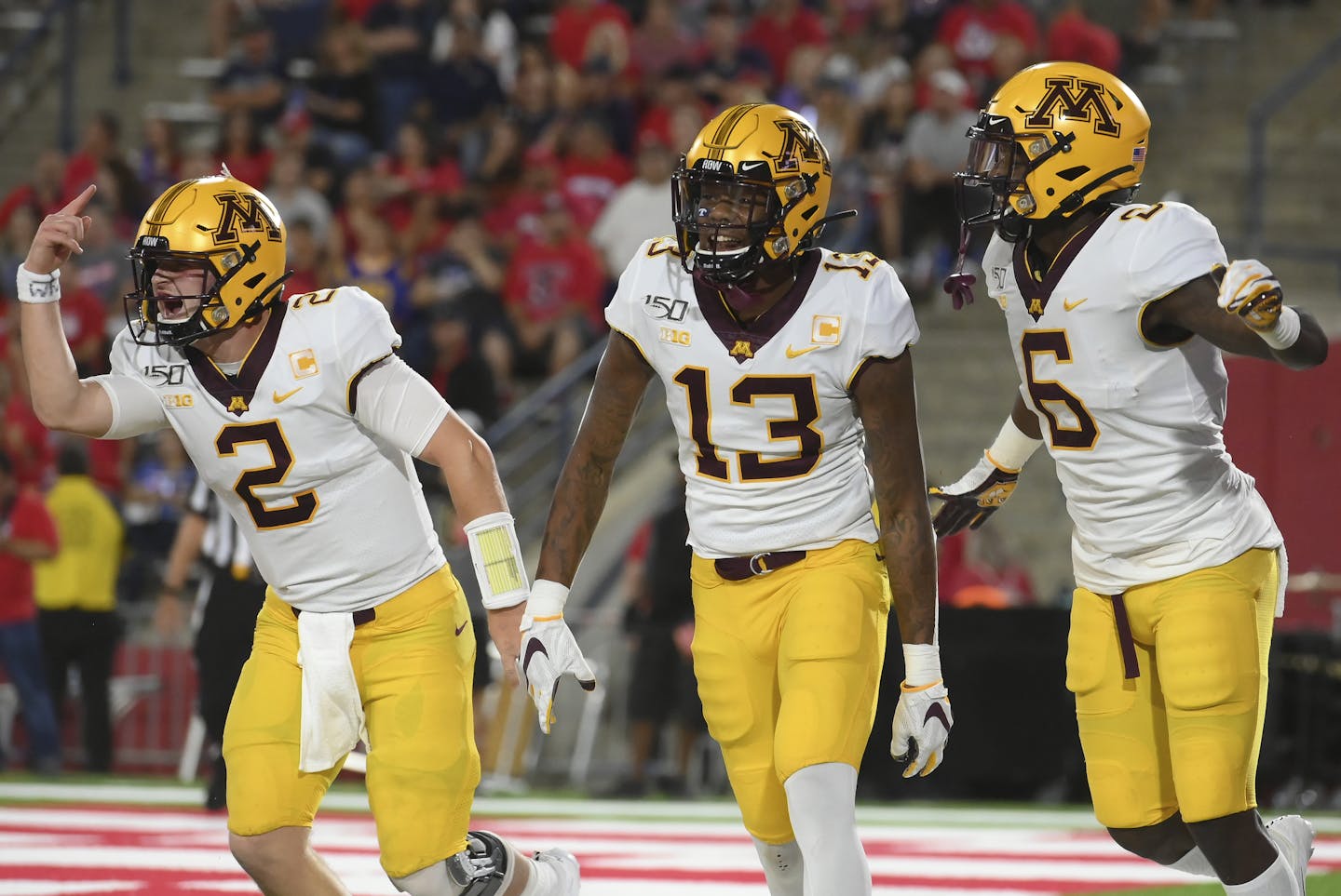 Gophers quarterback Tanner Morgan, wide receiver Rashod Bateman (13) and wide receiver Tyler Johnson (6) celebrated after a touchdown against Fresno State on Sept. 7.