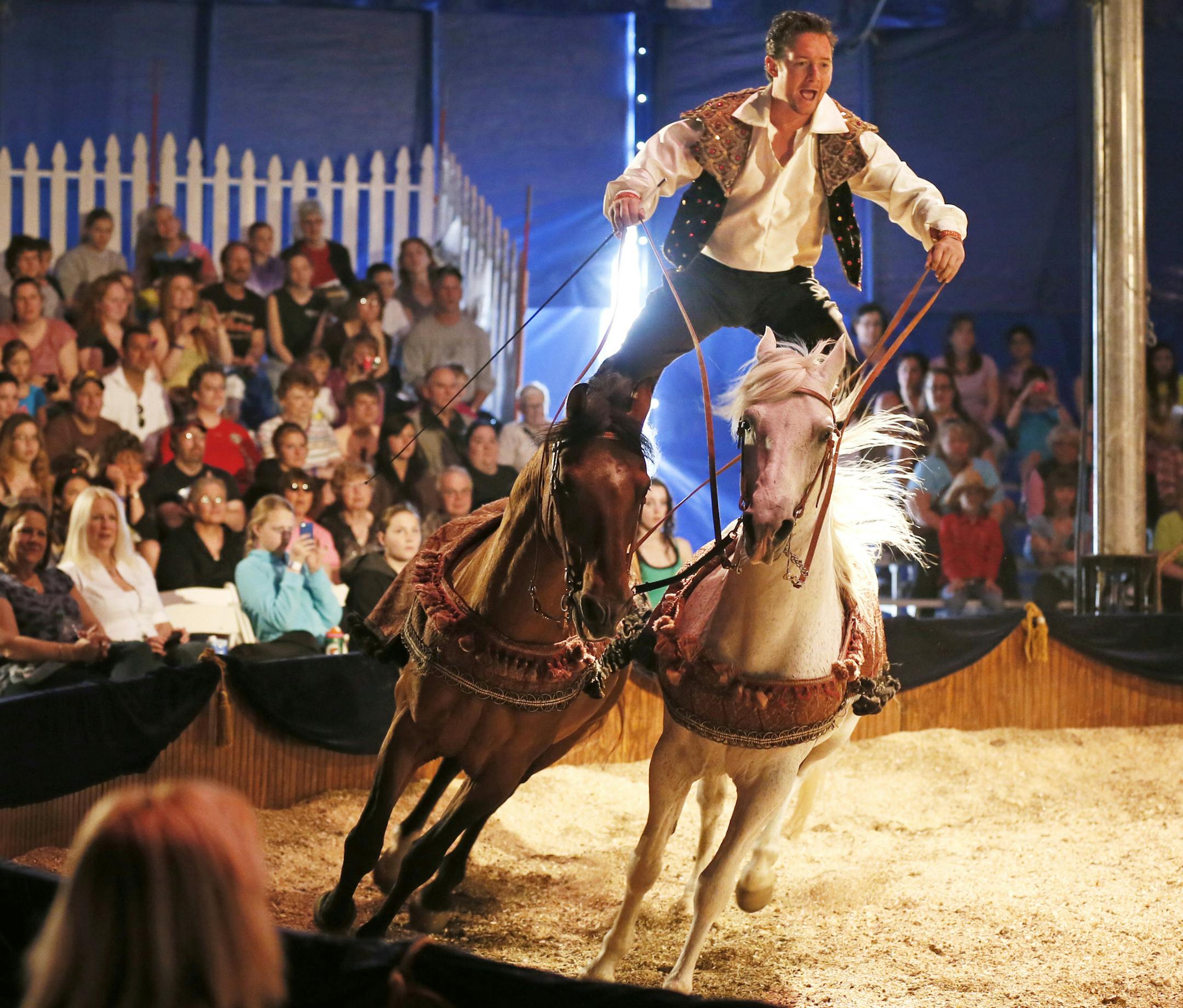 Olissio Zoppe performed as he road on the backs of two horses during a big top tent performance by Ma'Ceo at the Minnesota Horse Expo Sunday April, 28 2013 in St. Paul , MN. ] JERRY HOLT ‚Ä¢ jerry.holt@startribune.com
