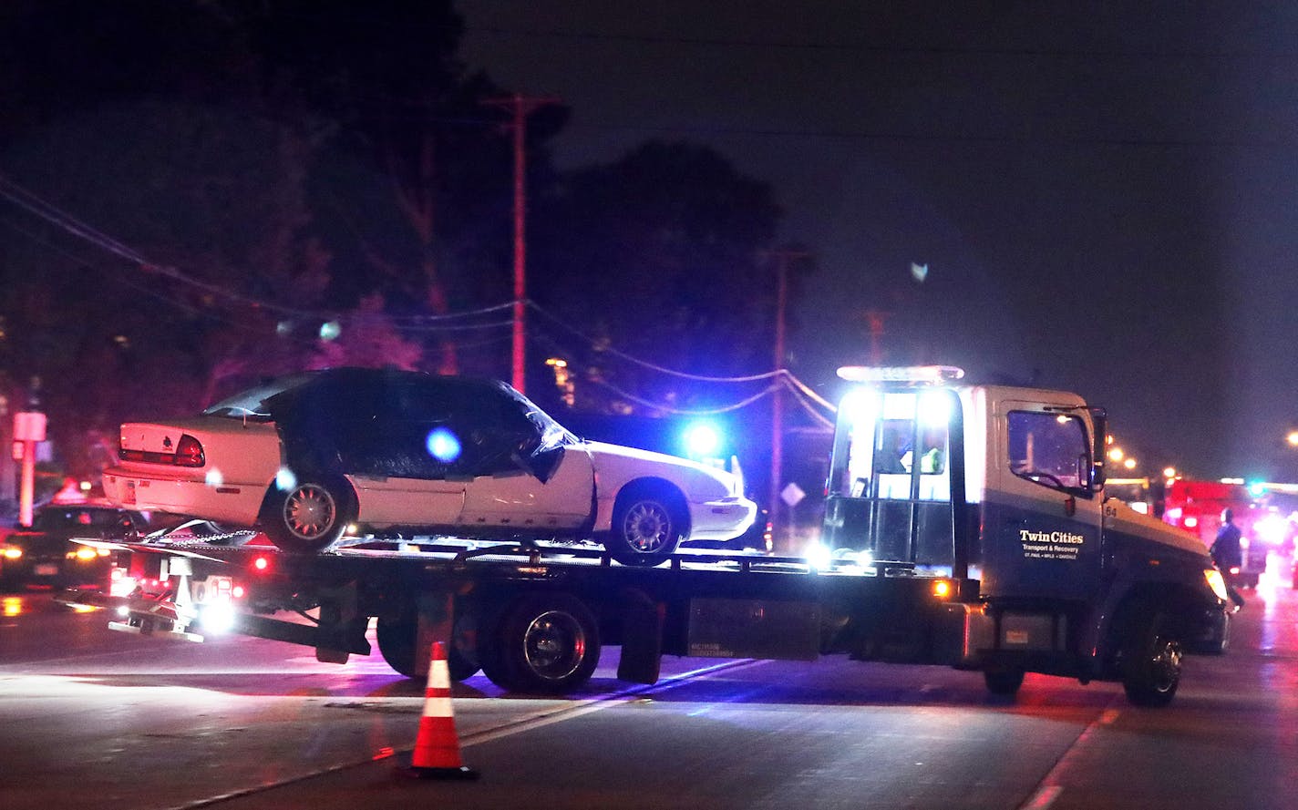 A car is towed away from the scene after Philando Castile was fatally shot in Falcon Heights.