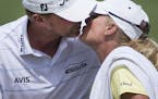 Steve Stricker kisses his wife and caddy, Nicki, after putting out on the 18th hole during the final round of the PGA Championship on Sunday, Aug. 16,