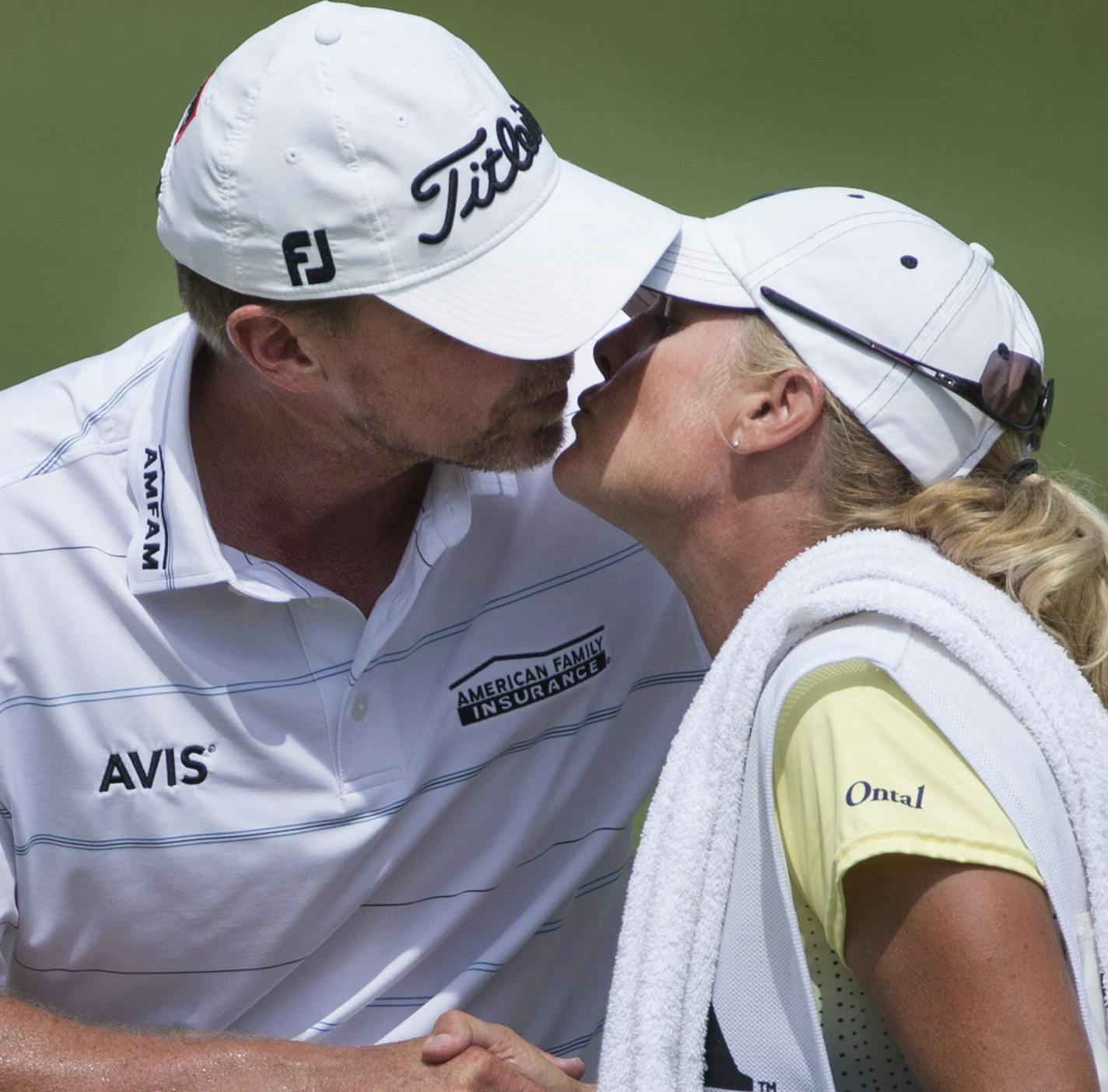 Steve Stricker kisses his wife and caddy, Nicki, after putting out on the 18th hole during the final round of the PGA Championship on Sunday, Aug. 16, 2015, at Whistling Straits in Haven, Wis. He finished -5 for the tournament, which he says might be the last time he plays in a major. (Mark Hoffman/Milwaukee Journal Sentinel/TNS)