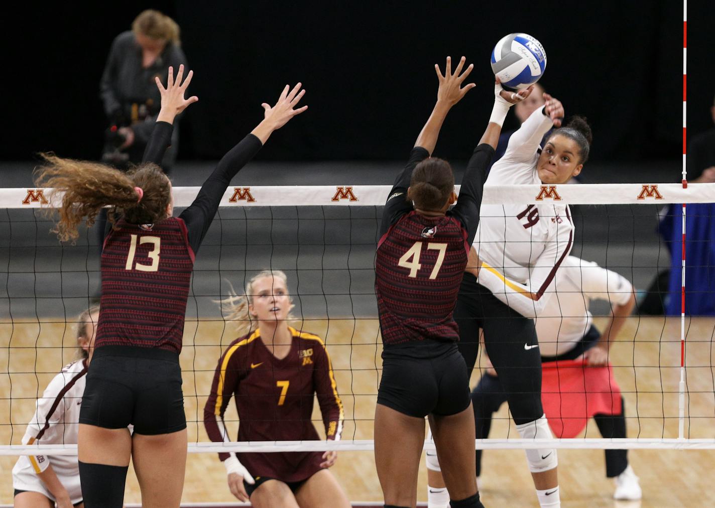 Gophers outside hitter Alexis Hart spikes the ball over Florida State middle blocker Deja Williams