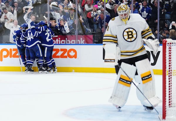 Maple Leafs players celebrate after William Nylander's goal as Bruins goaltender Jeremy Swayman looks away on during second-period action in Game 6 in