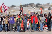 Native Americans make their way on a 7-mile walk, from four different locations, to honor the 1973 Wounded Knee occupation in Wounded Knee, South Dako