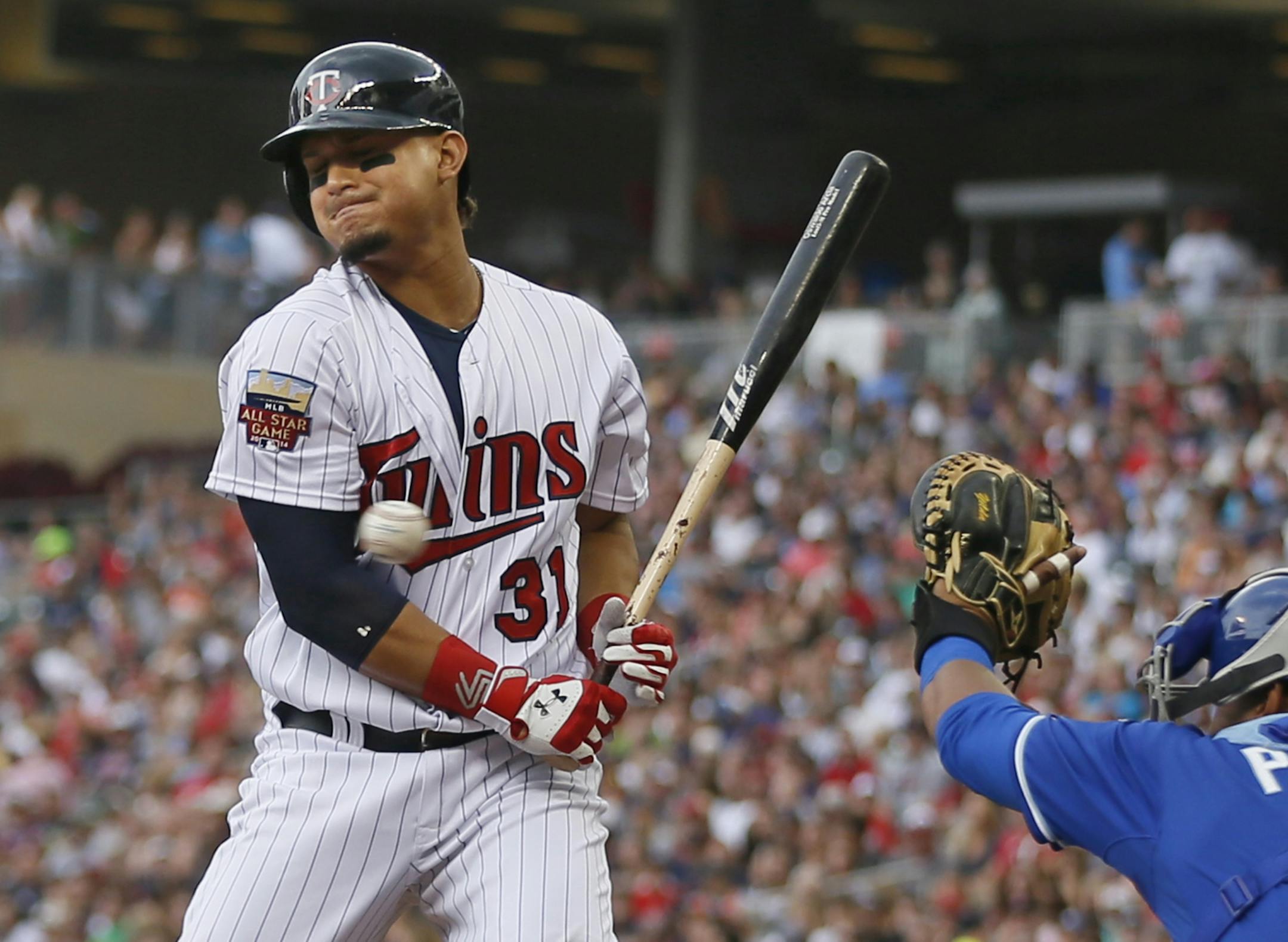 Minnesota Twins right fielder Oswaldo Arcia (31) was avoid getting hit by Kansas City Royals pitcher Jeremy Guthrie (11) in the first inning at Target Field Sunday August 17 , 2014 in Minneapolis MN .