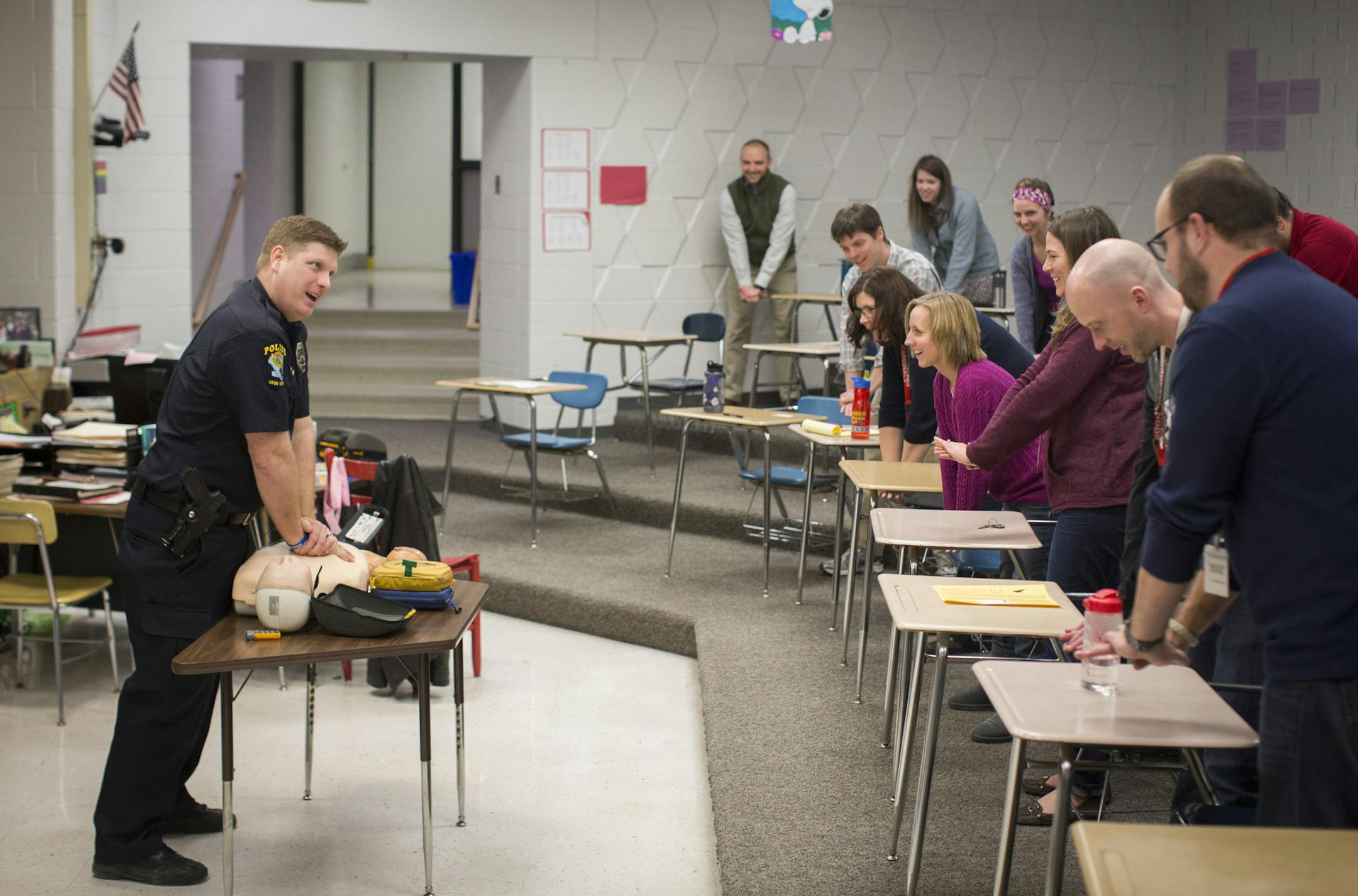 Officer Bryan Platz practiced with the class how to do CPR during a class for a group of teachers at Coon Rapids High School on Thursday, February 11, 2016, in Coon Rapids, Minn. ] RENEE JONES SCHNEIDER • reneejones@startribune.com