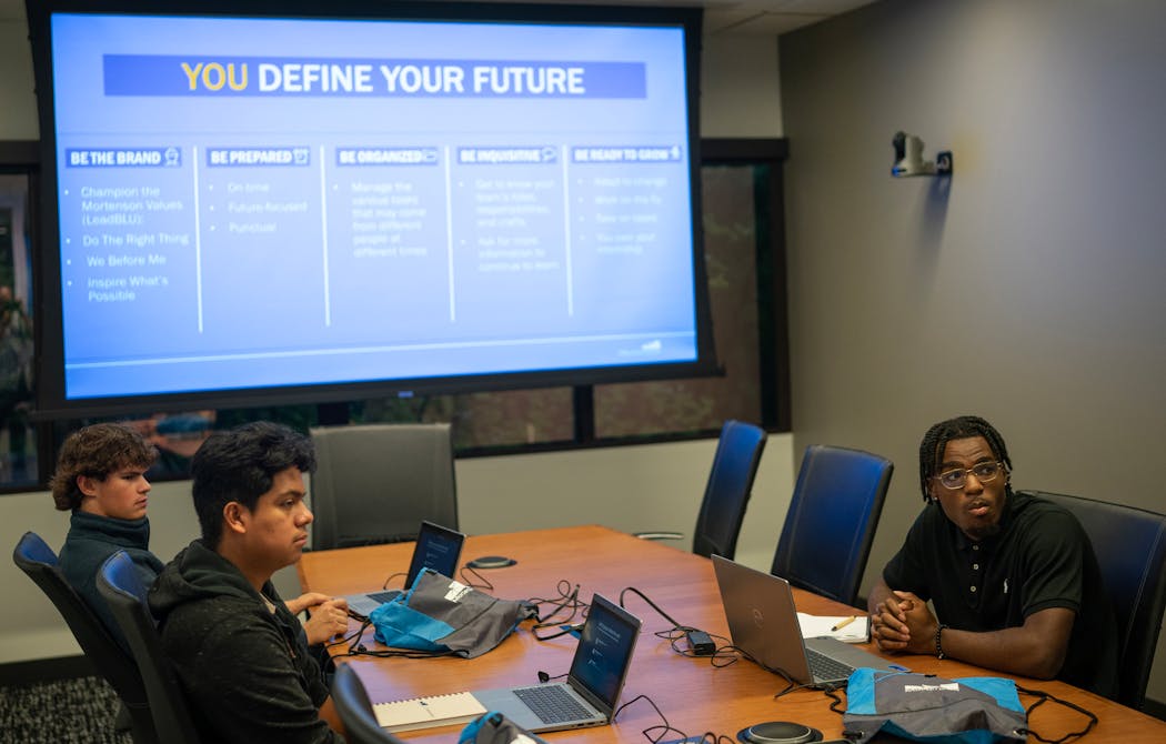 Mortenson Scholars, from left, Matt Isaak, Henry Cacique and Da’Kwon Young listen in during a September orientation for the Mortenson programs in Golden Valley.