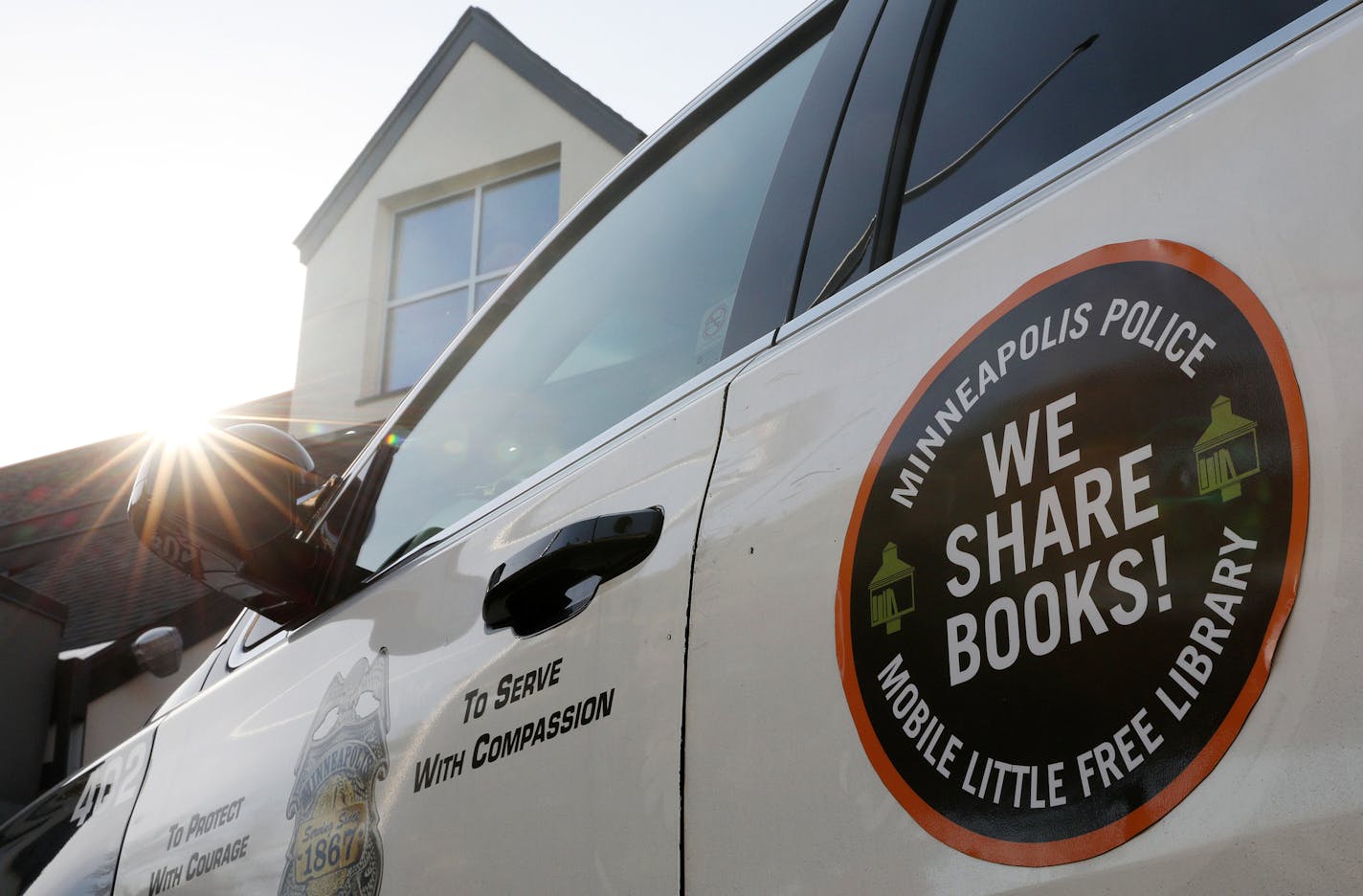 A new logo sat affixed to a patrol vehicle that will indicate that it is fitted with a Mobile Little Free Library carrying books to share with community members. ] ANTHONY SOUFFLE &#xef; anthony.souffle@startribune.com Police Chief Medaria Arradondo and a handful CET officers spent a few hours building free-standing little free libraries that can be seen around the city at the station Tuesday, Oct. 17, 2017 at the Fourth Precinct in Minneapolis. The Minneapolis Police Department is launching wha