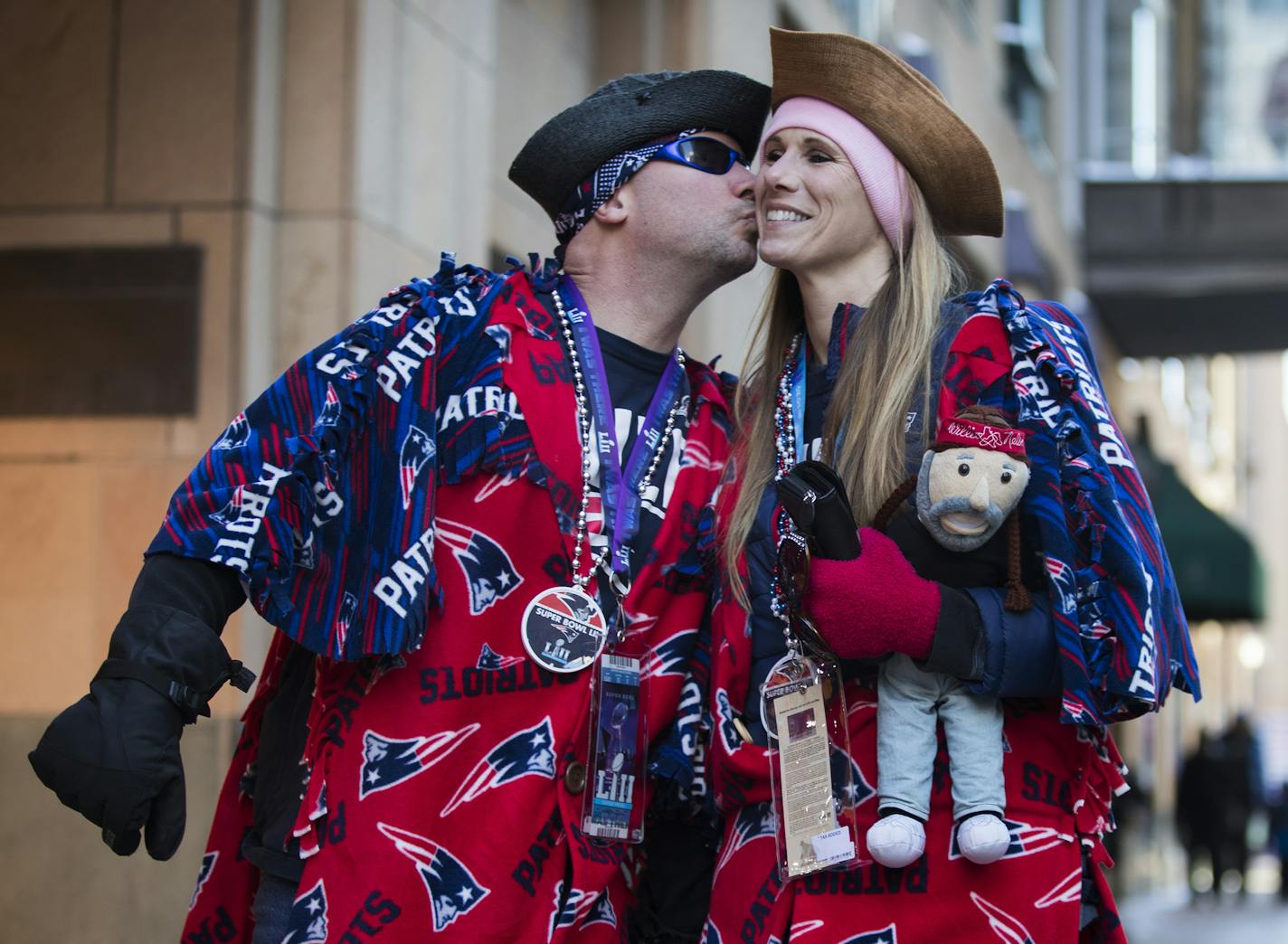 Patriots fans Rick Carlson and Karin Holland of Boston sport handmade Patriots ponchos that were made by Rick. ] LEILA NAVIDI &#xef; leila.navidi@startribune.com BACKGROUND INFORMATION: The scene at Super Bowl Live on Nicollet Mall before the game on Sunday, February 4, 2018. Performances on Sunday included DJ Dudley D and 13 Crowns.