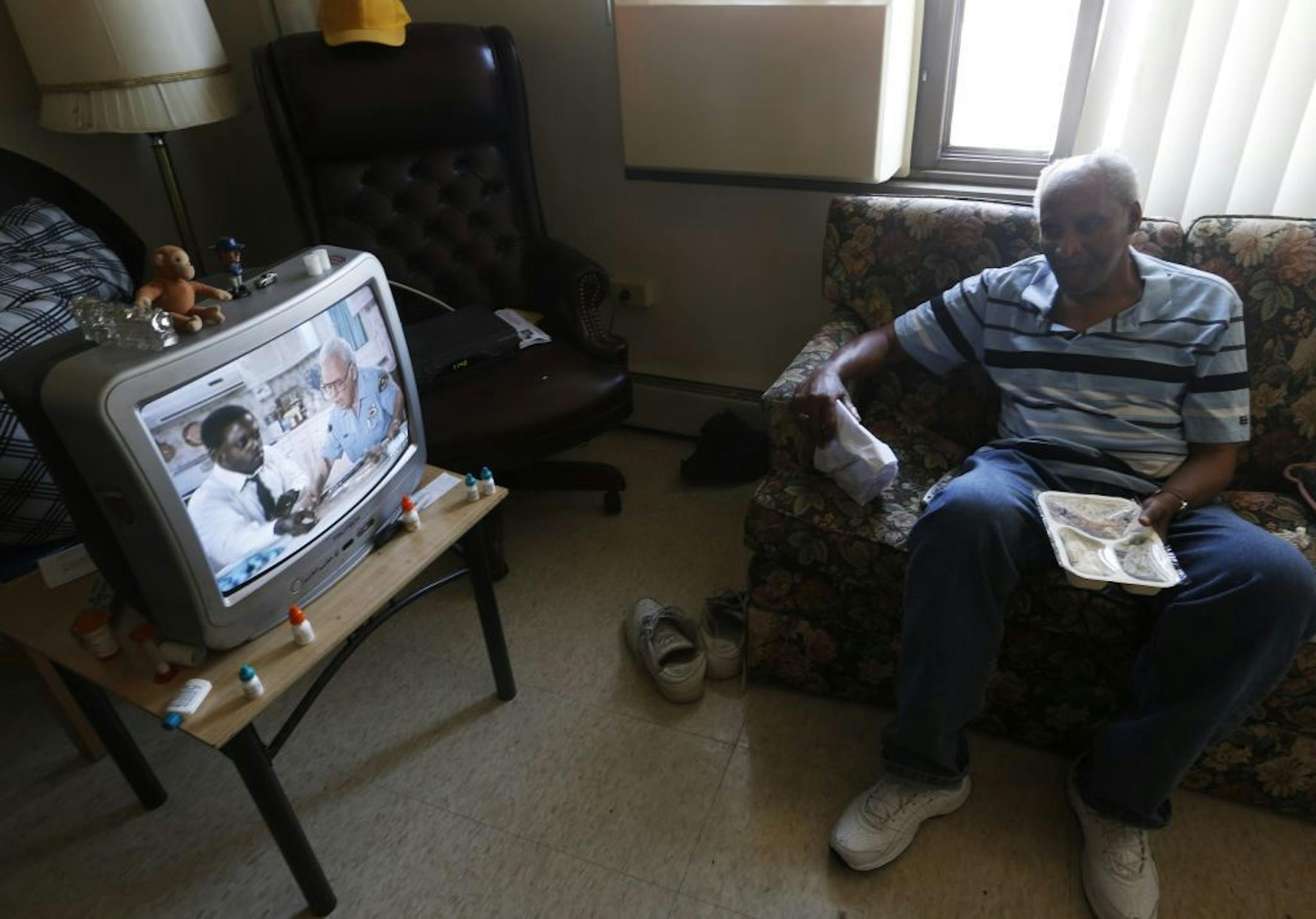 During a scorching day on Monday 3/11/12, Charles Harden,62, got a Meals on Wheels delivery to his apartment by Kate Maas. The apartment does not have air conditioning. Harden said he would have to pay extra to have unit put in .