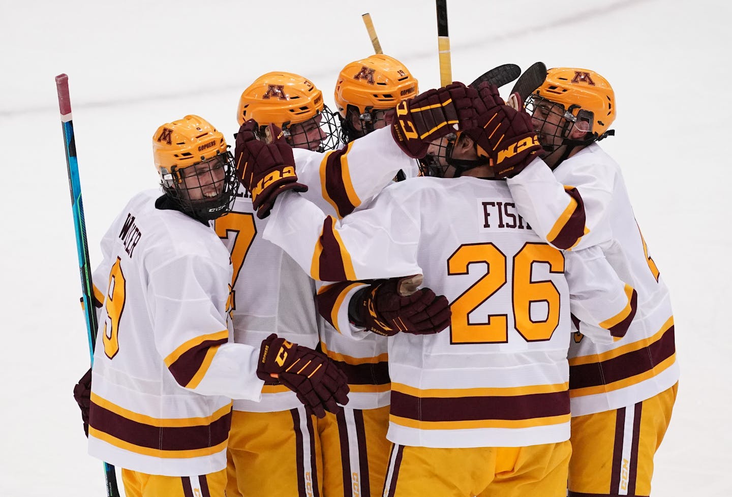 Minnesota defenseman Carl Fish (26) was congratulated by his teammates after scoring his first goal in the second period. ] ANTHONY SOUFFLE • anthony.souffle@startribune.com