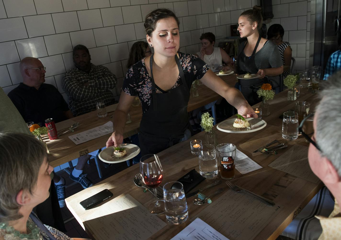 At Birdie, chefs are also servers. Tlanezi Guzman, center, and Brittany St. Clair, right, present deviled eggs, the first of a dozen courses.