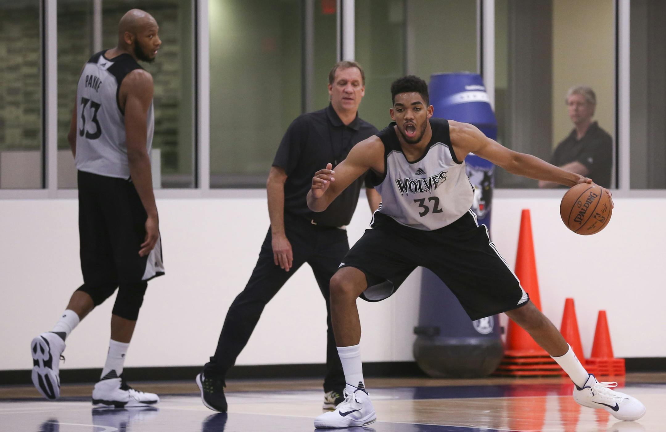 The Timberwolves' number one draft pick, Karl-Anthony Towns, foreground, and Adreian Payne drilled with head coach Flip Saunders during a minicamp.