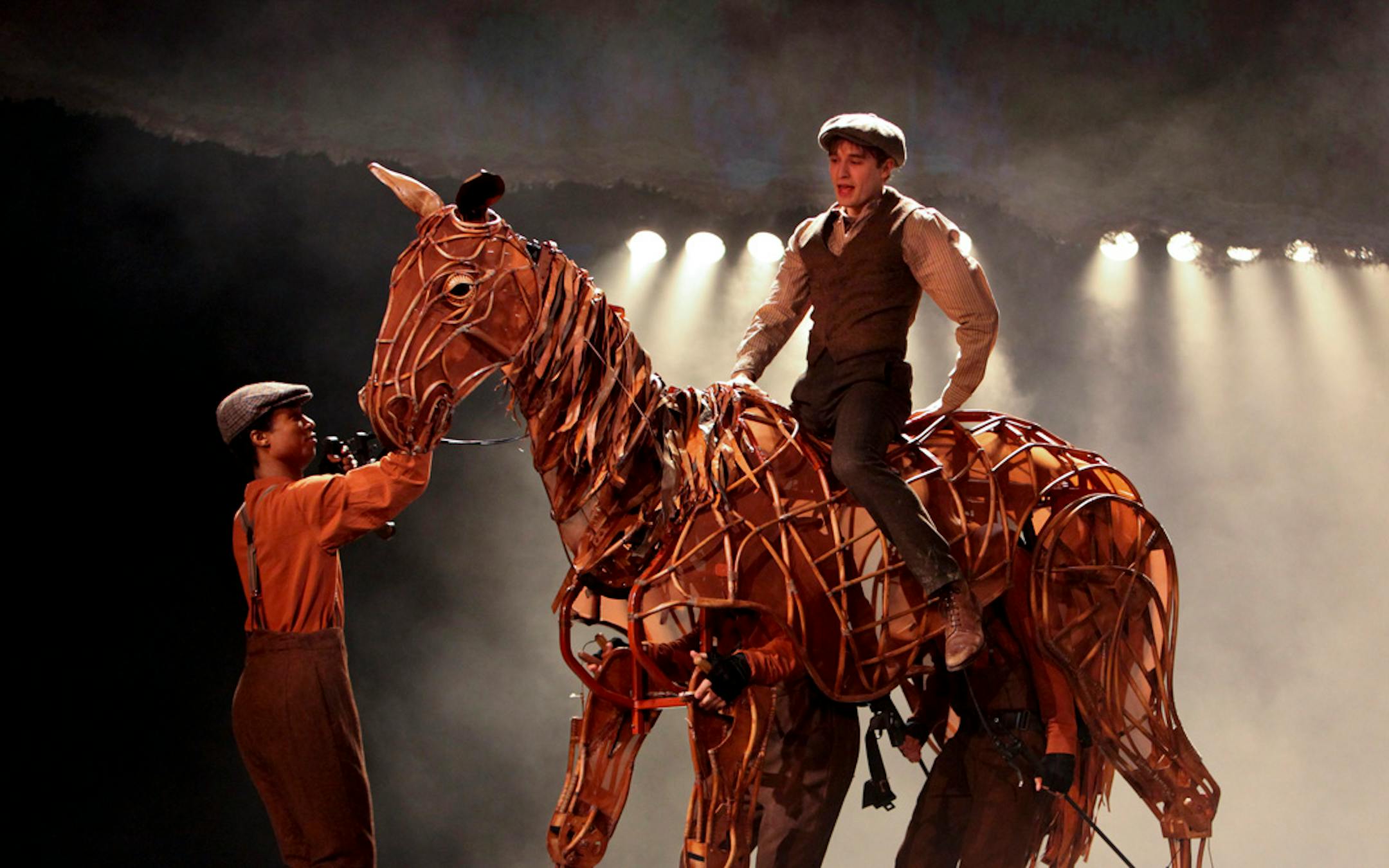 Seth Numrich as Albert rides atop the puppet horse Joey in "War Horse."