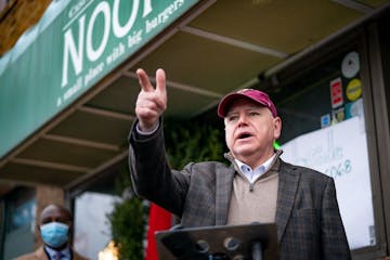 Gov. Tim Walz stood in front of Casper's and Runyon's Nook in St. Paul to roll out a proposal for a legislative relief package aimed at helping busine