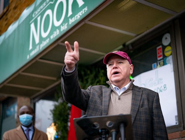 Gov. Tim Walz stood in front of Casper's and Runyon's Nook in St. Paul to roll out a proposal for a legislative relief package aimed at helping busine
