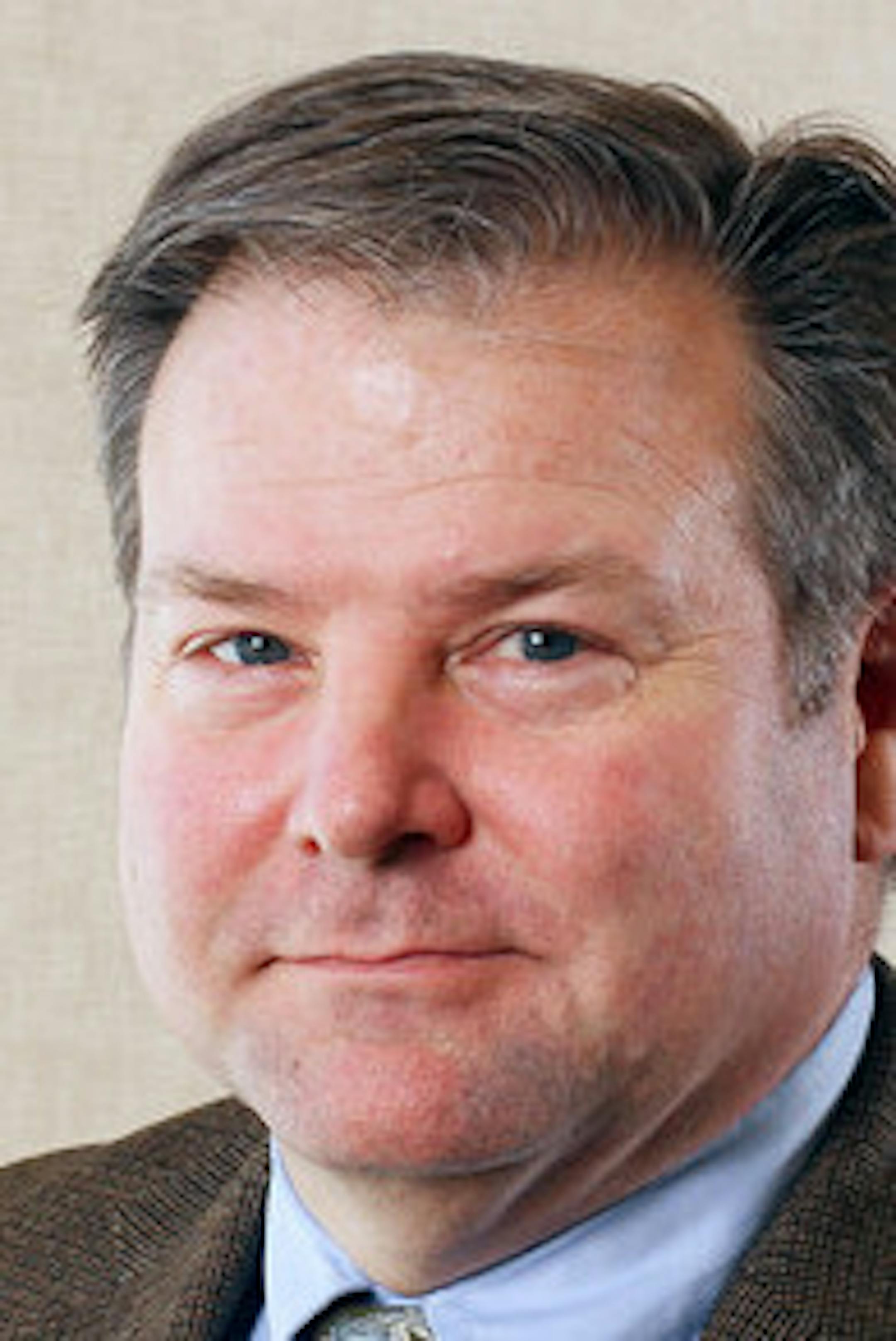 Environmental portrait of Mike Porter taken on Friday, March 8, 2013 on the St. Paul campus of the University of St. Thomas.