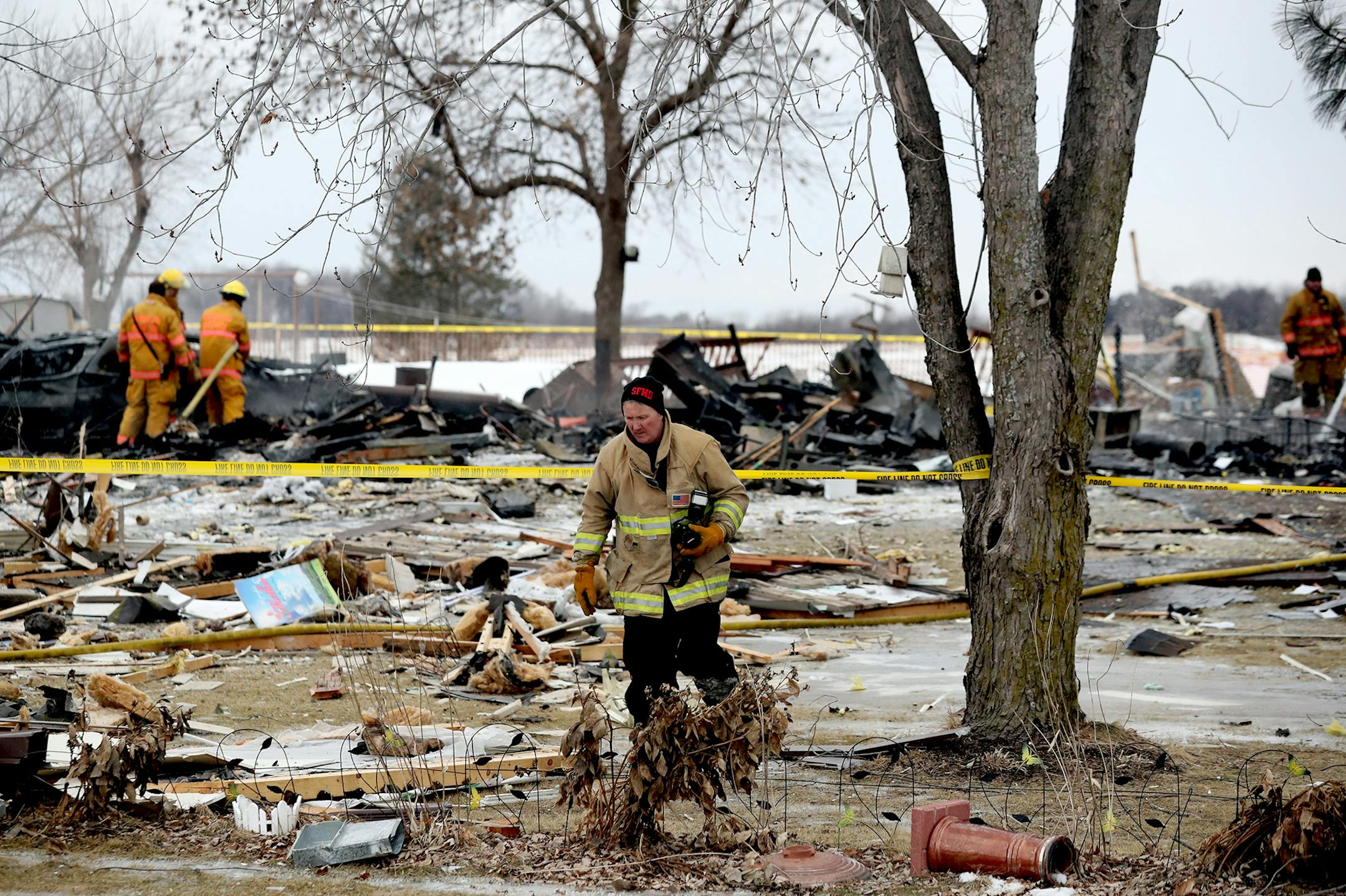 Firefighters sift through the rubble after one person died and another was seriously injured following a house explosion Tuesday, Feb. 5, 209, in the southern Dakota County community of Hampton, MN.] DAVID JOLES •david.joles@startribune.com One person died and another was seriously injured after a house exploded Tuesday morning in the southern Dakota County community of Hampton.