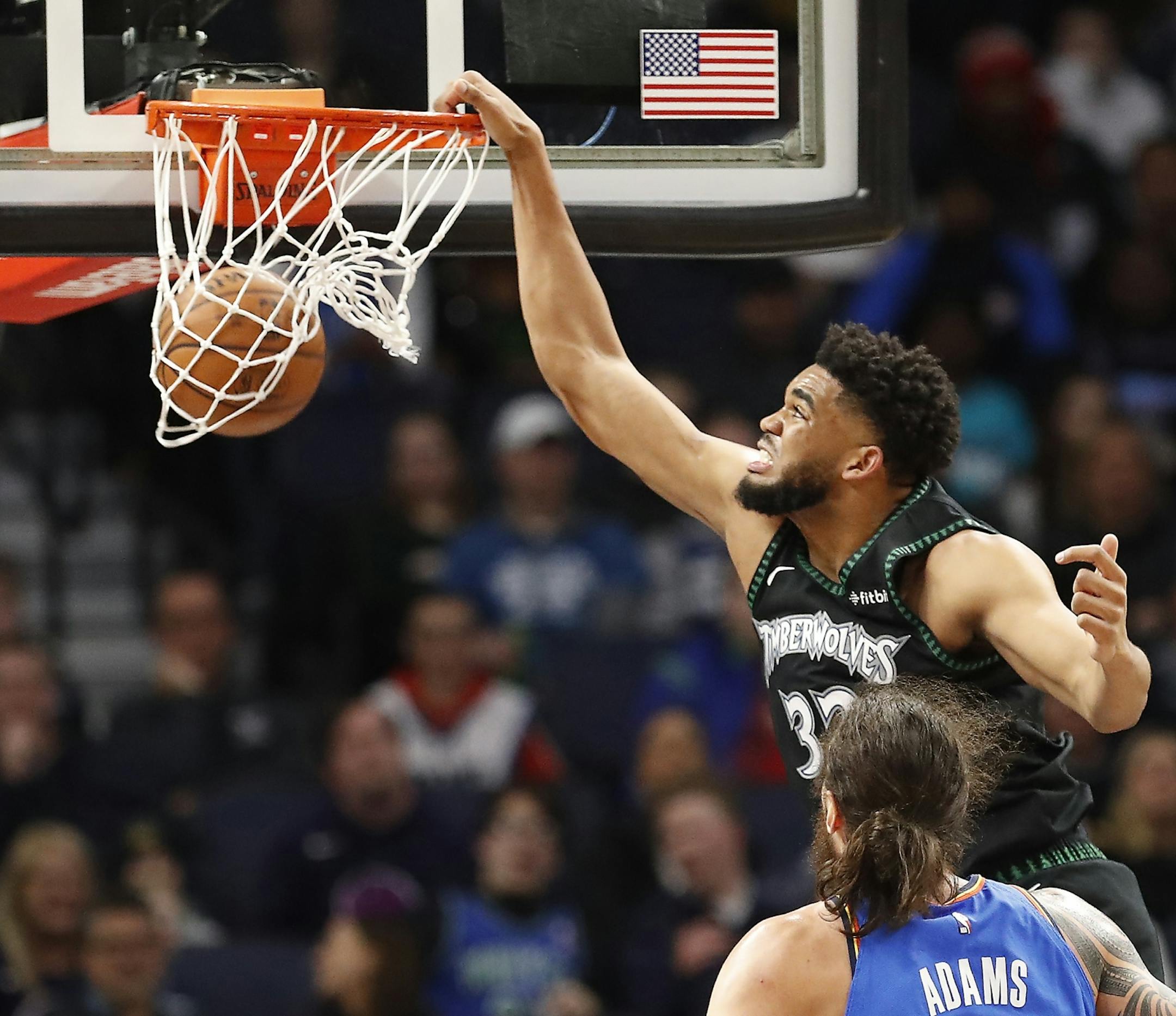 Minnesota Timberwolves center Karl-Anthony Towns (32) dunks the ball during the second half.