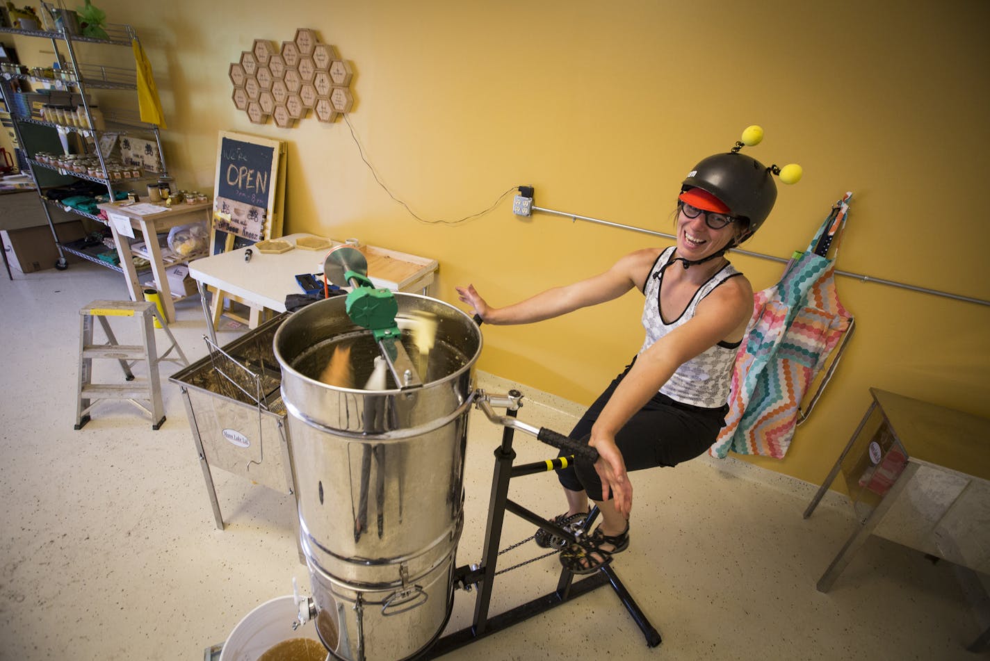 Beez Kneez founder Kristy Allen used a honey extractor hooked to a bicycle to process honey from one of her hives at their Beez Kneez honey house on June 24, 2014 in Minneapolis, Minn. ] RENEE JONES SCHNEIDER &#x201a;&#xc4;&#xa2; reneejones@startribune.com