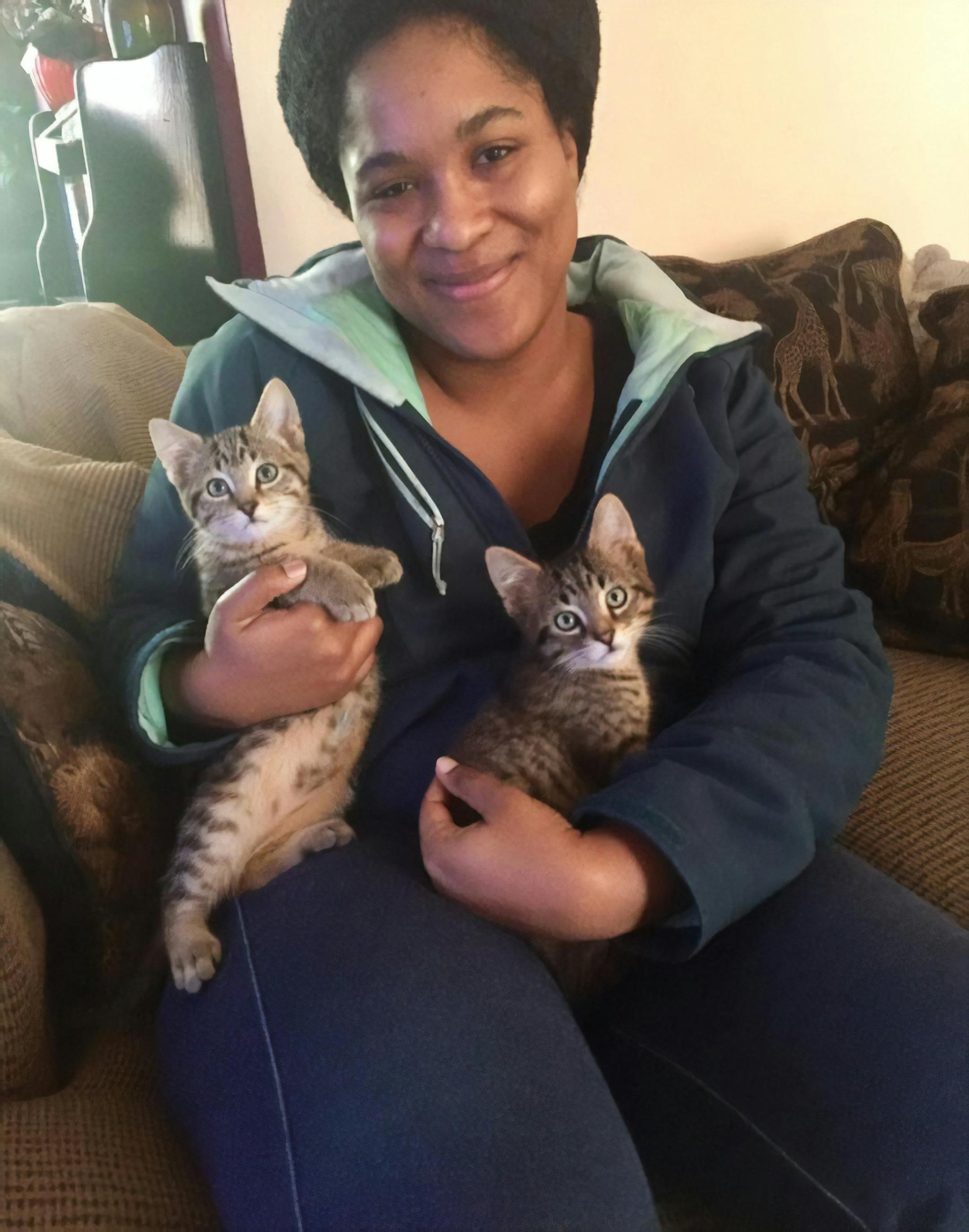 Sydnee Thompson and the two cats she adopted from the Ferndale Cat Shelter.
