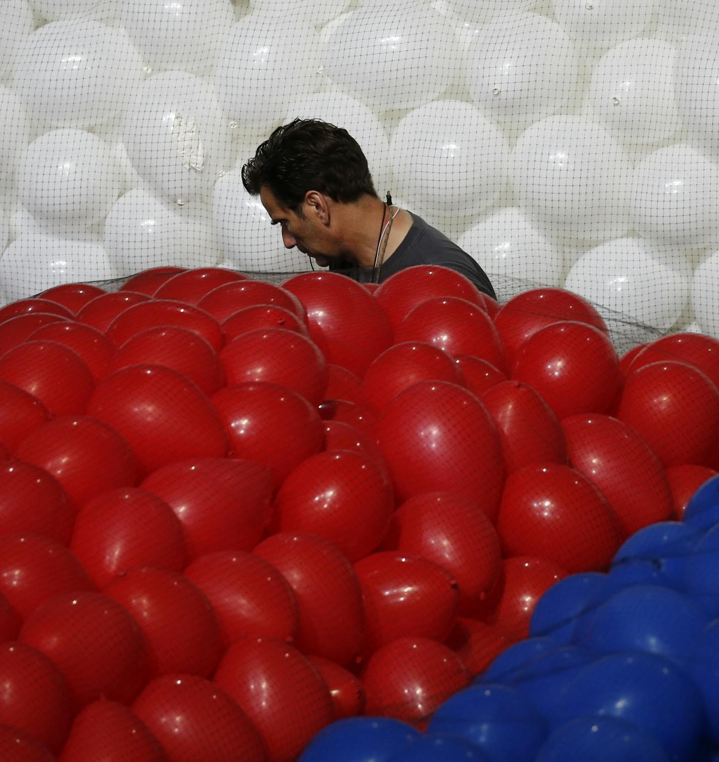 Setting up balloons for the Democratic National Convention, at the Wells Fargo Center in Philadelphia, July 22, 2016. Hillary Clinton reportedly selected Sen. Tim Kaine, the Virginia democrat, as her running mate on Friday night. (Josh Haner/The New York Times)