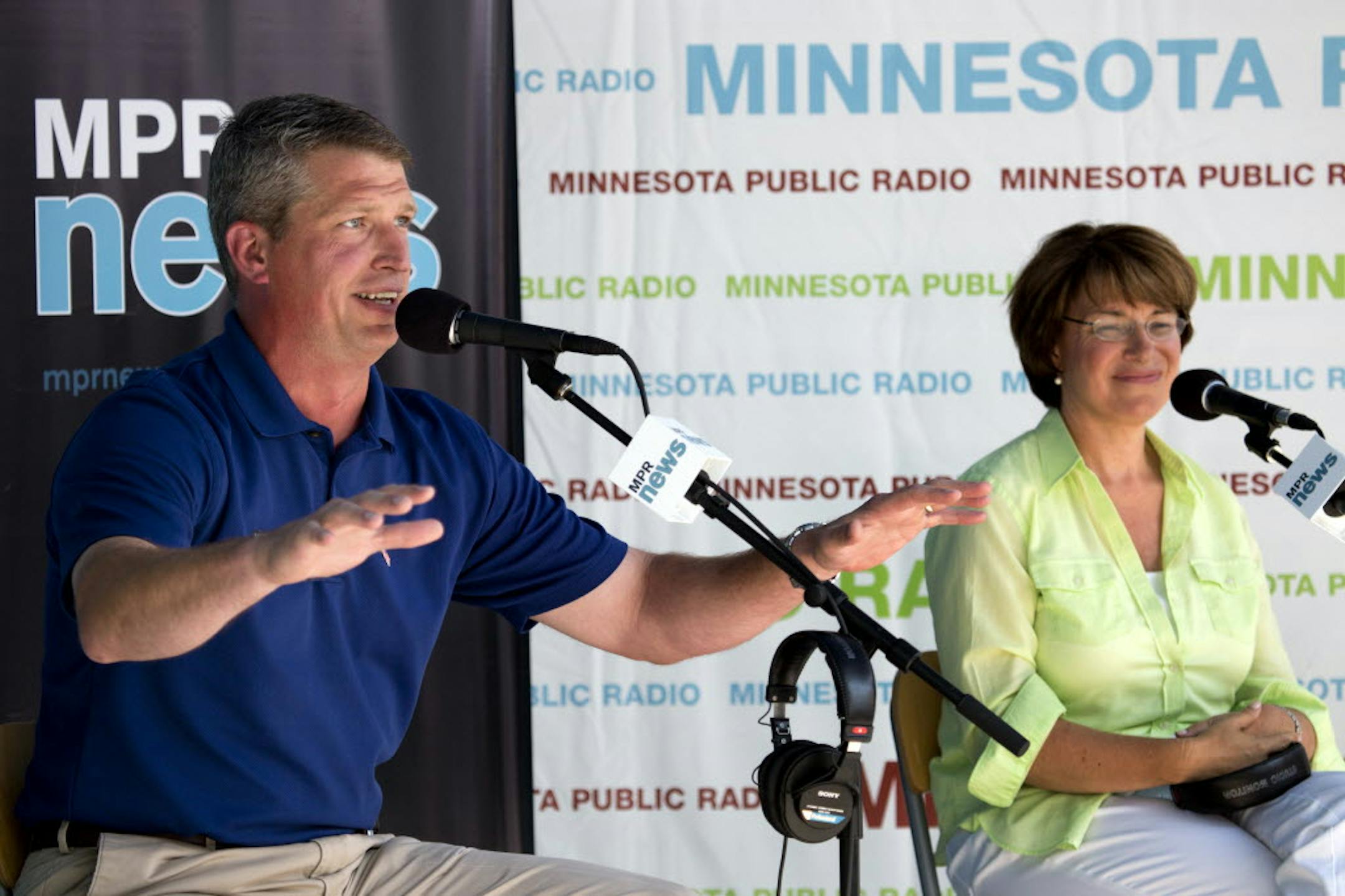 Sen. Amy Klobuchar, right, (DFL) and Rep. Kurt Bills (R) debate Thursday at the State Fair.