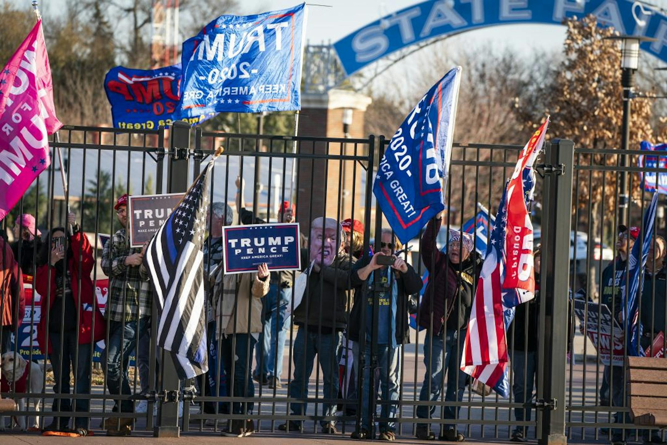 Trump supporters made noise nearby as former Vice President Joe Biden spoke during a drive-in campaign event in Falcon Heights.