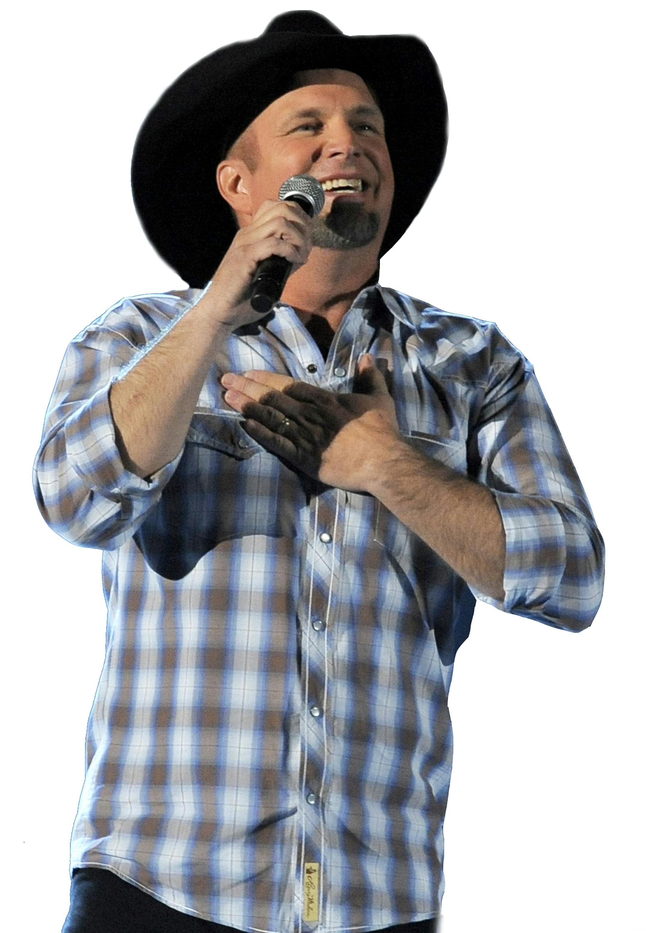 FILE - This April 7, 2013 file photo shows Garth Brooks performing at the 48th Annual Academy of Country Music Awards in Las Vegas, Nev. Brooks is a granddaddy. The country music superstar issued a statement Friday acknowledging the birth of his first grandchild, Karalynn. His daughter August gave birth earlier this week. (Photo by Chris Pizzello/Invision/AP, File) ORG XMIT: MIN2013112610442215