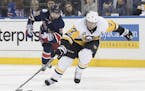 FILE - In this March 31, 2017, file photo, Pittsburgh Penguins center Matt Cullen (7) controls the puck as he skates past New York Rangers right wing 