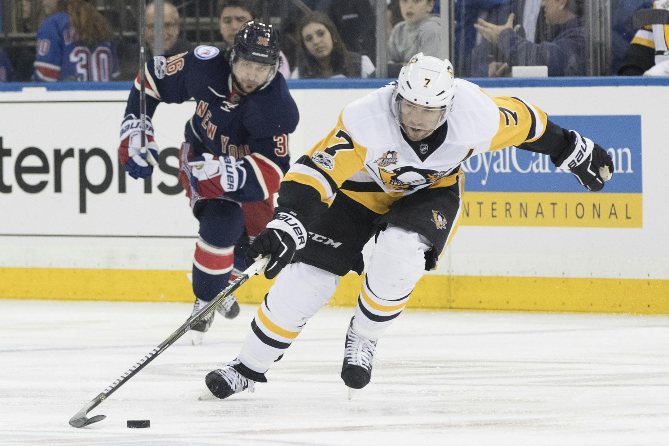 FILE - In this March 31, 2017, file photo, Pittsburgh Penguins center Matt Cullen (7) controls the puck as he skates past New York Rangers right wing Mats Zuccarello during an NHL hockey game in New York. Cullen, at 40, could be among the players available when free agency begins Saturday. (AP Photo/Mary Altaffer, File)