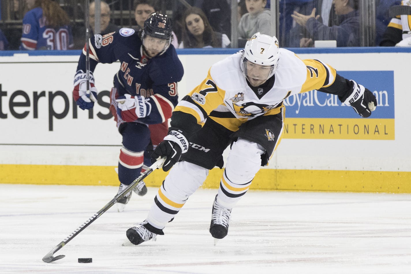 FILE - In this March 31, 2017, file photo, Pittsburgh Penguins center Matt Cullen (7) controls the puck as he skates past New York Rangers right wing Mats Zuccarello during an NHL hockey game in New York. Cullen, at 40, could be among the players available when free agency begins Saturday. (AP Photo/Mary Altaffer, File)