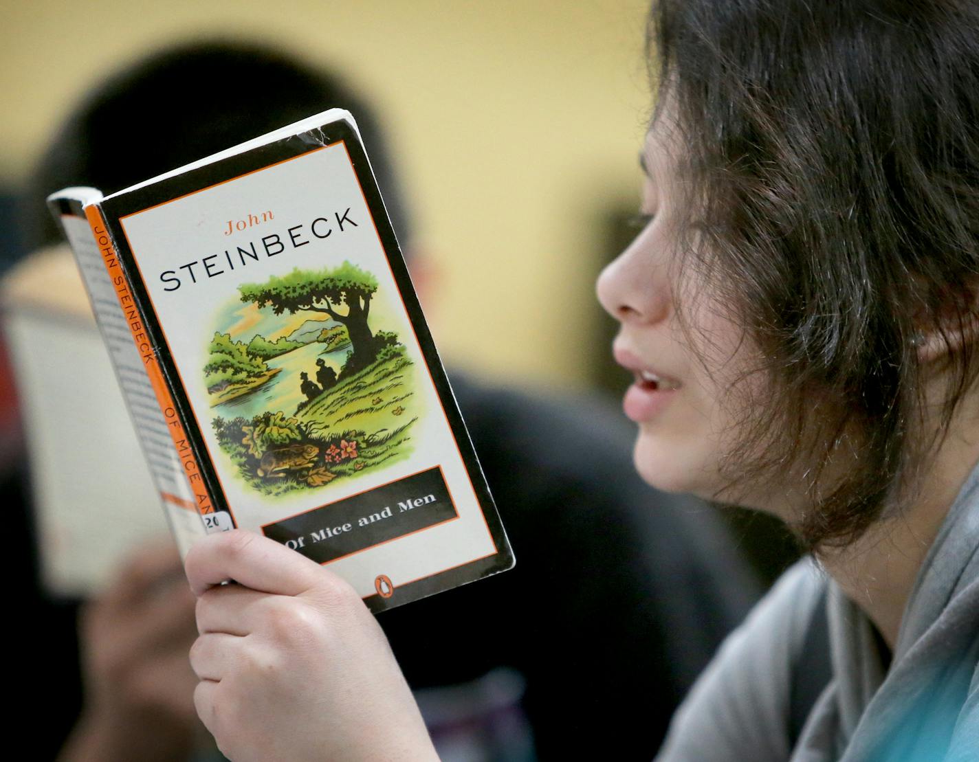 In language arts class, Esmeralda Garcia, a ninth grader, read aloud from John Steinbeck's "Of Mice and Men," to students at her table at El Colegio Charter School, where the graduation rate has more than doubled since last year, Tuesday, Feb. 24, 2015, in Minneapolis, MN.] (DAVID JOLES/STARTRIBUNE)djoles@startribune.com El Colegio Charter School: The largest increase statewide in grad rates since last year. More than doubled its graduation rate. However, that rate is still only 23.8 percent (up