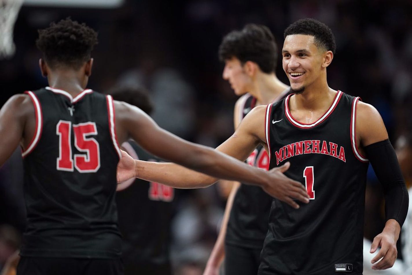 Hercy Miller and Jalen Suggs congratulate each other in Minnehaha Academy's victory over Sierra Canyon (Cal.) on Jan. 4