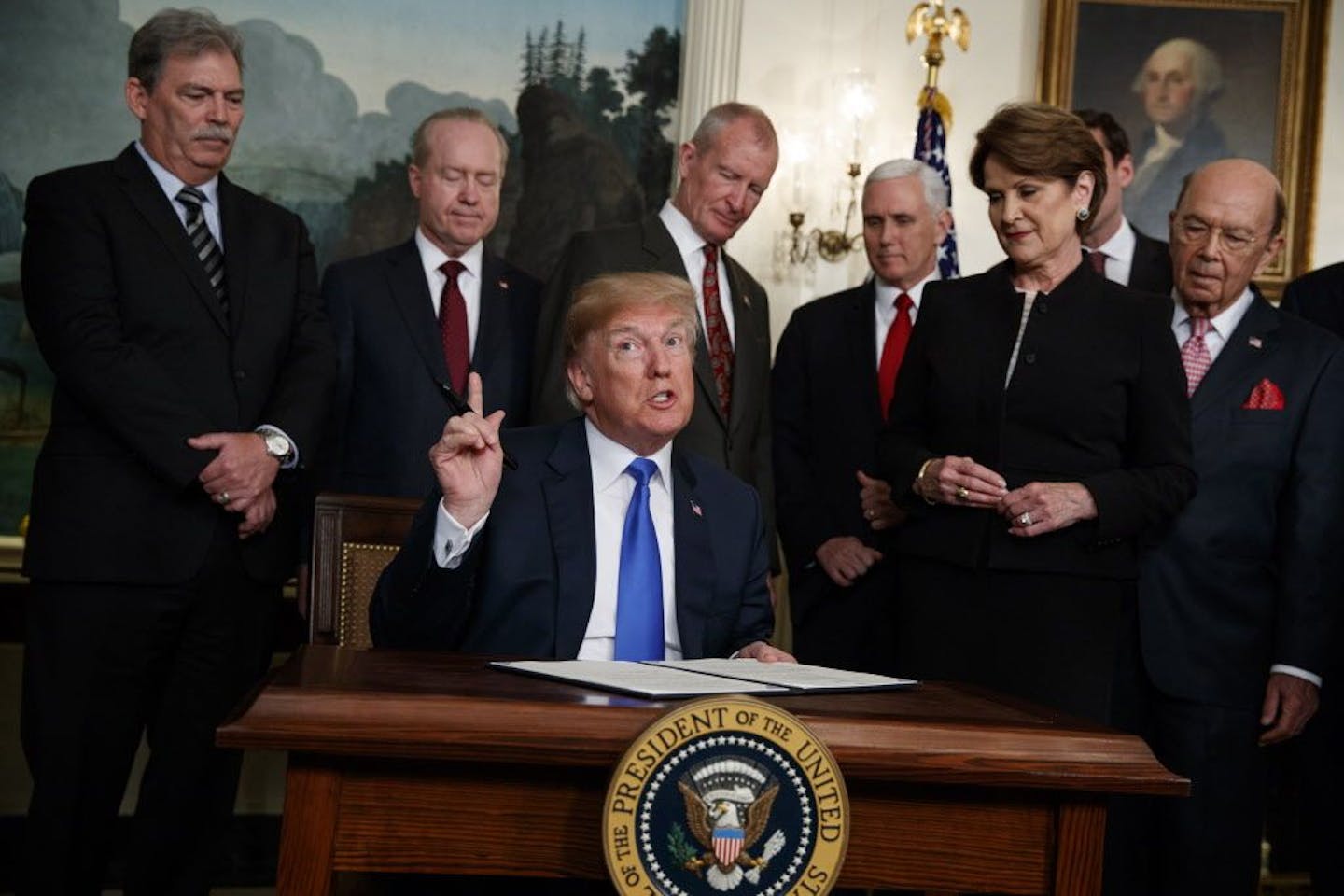 President Donald Trump speaks before he signs a presidential memorandum imposing tariffs and investment restrictions on China in the Diplomatic Reception Room of the White House, Thursday, March 22, 2018, in Washington.