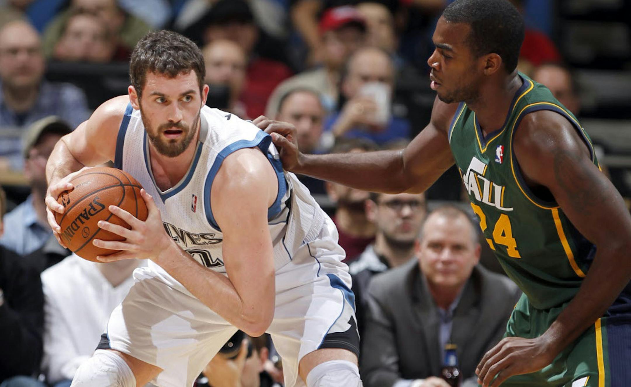 Wolves All-Star forward Kevin Love was defended by Utah's Paul Milsap.