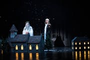 Kurt Kwan, left, is the Ghost of Christmas Past and Matthew Saldivar plays Scrooge in the 2023 production of “A Christmas Carol” at the Guthrie Th