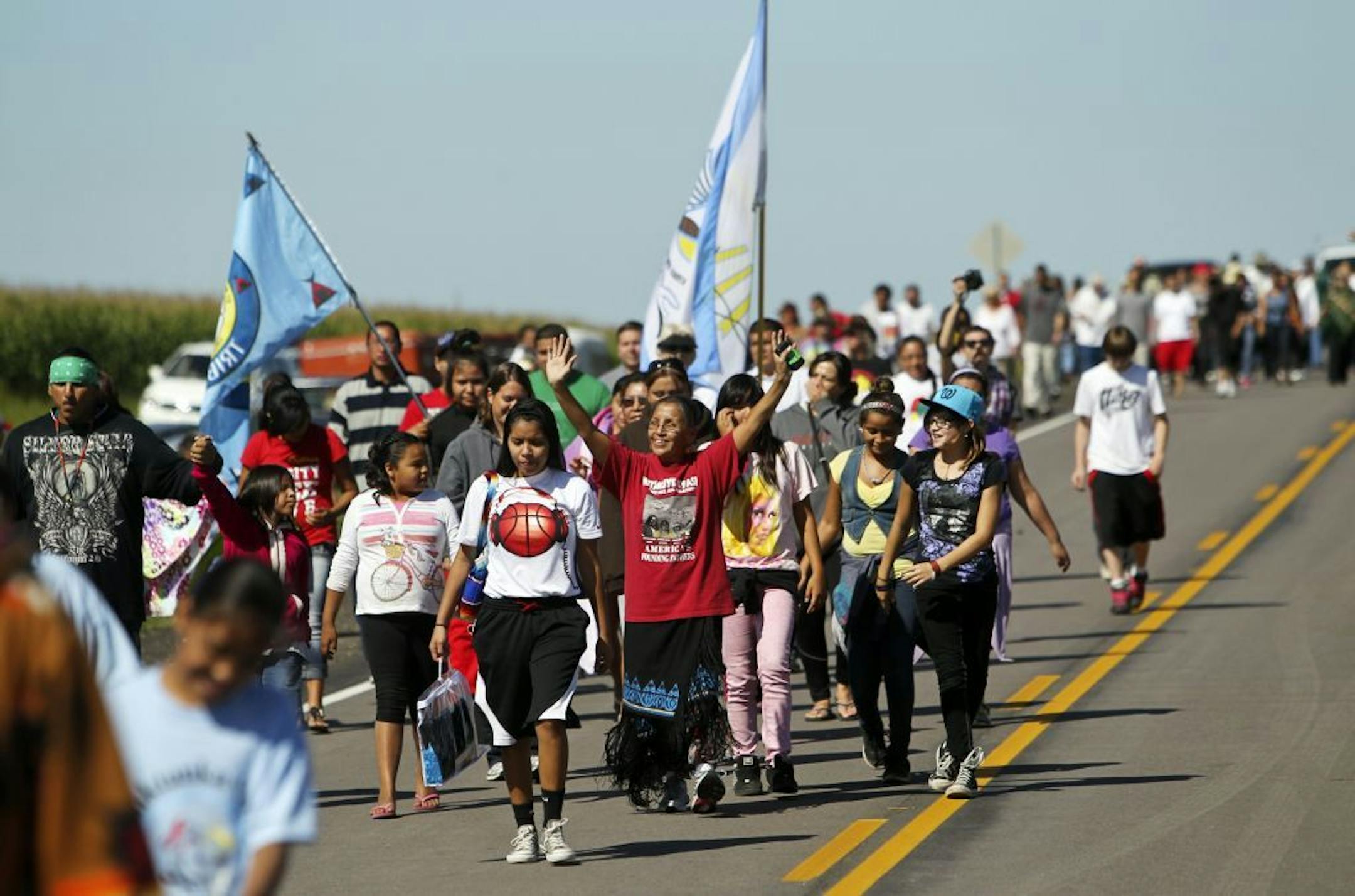 Members of the Wabasha family from Santee, Neb., walked across the border from South Dakota to Minnesota on Hwy. 30 on Friday, symbolizing the return of the Dakota people exiled after the U.S.-Dakota War 150 years ago.