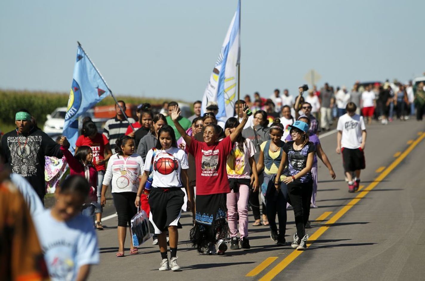 Members of the Wabasha family from Santee, Neb., walked across the border from South Dakota to Minnesota on Hwy. 30 on Friday, symbolizing the return of the Dakota people exiled after the U.S.-Dakota War 150 years ago.