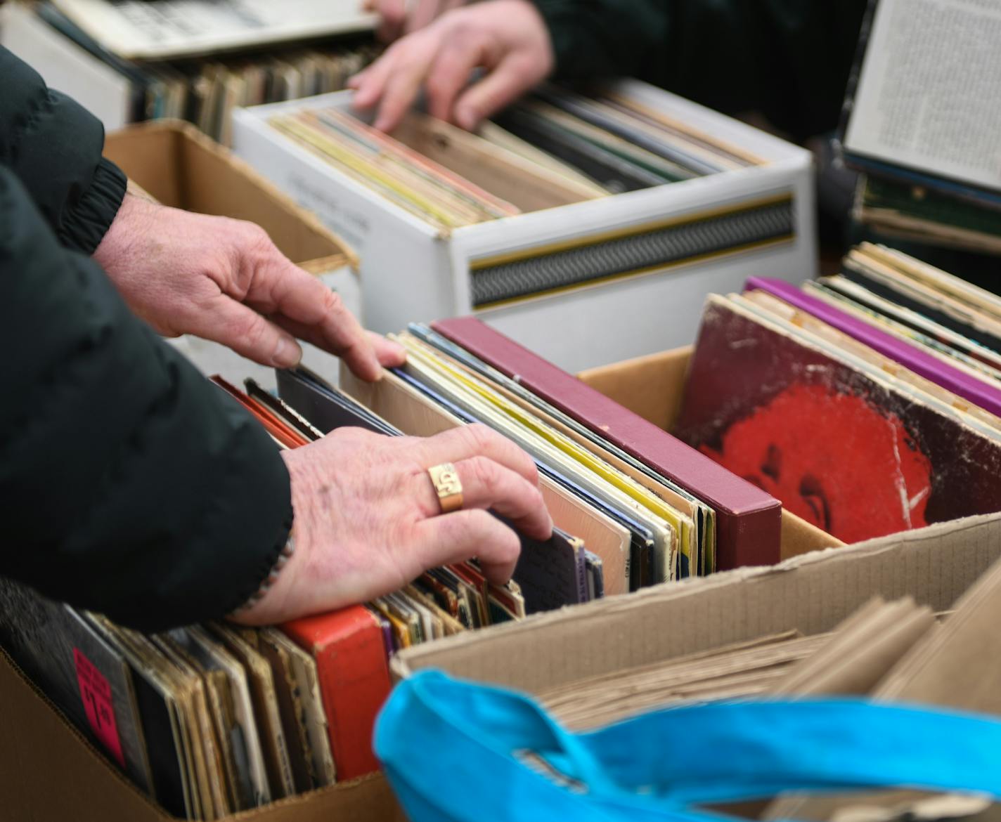 James (JD) Davis looked through a box of free records.] COURTNEY DEUTZ &#x2022; courtney.deutz@startribune.com on Saturday, April 13, 2019 at Hymie's Vintage Records in Minneapolis. Hymie's hosted a block party to celebrate Record Store Day. Davis said he likes the "old-school" way of listening to music on vinyl records.