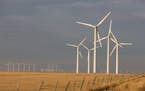 1.5 Megawatt wind turbines sit in a field at sunrise just south of Lamar, Colorado, U.S., on Friday, Nov. 6, 2009. The 162 megawatt (MW) Colorado Gree