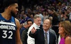 Timberwolves center Karl-Anthony Towns was congratulated by team owner Glen Taylor and his wife Becky after a win over the Golden State Warriors