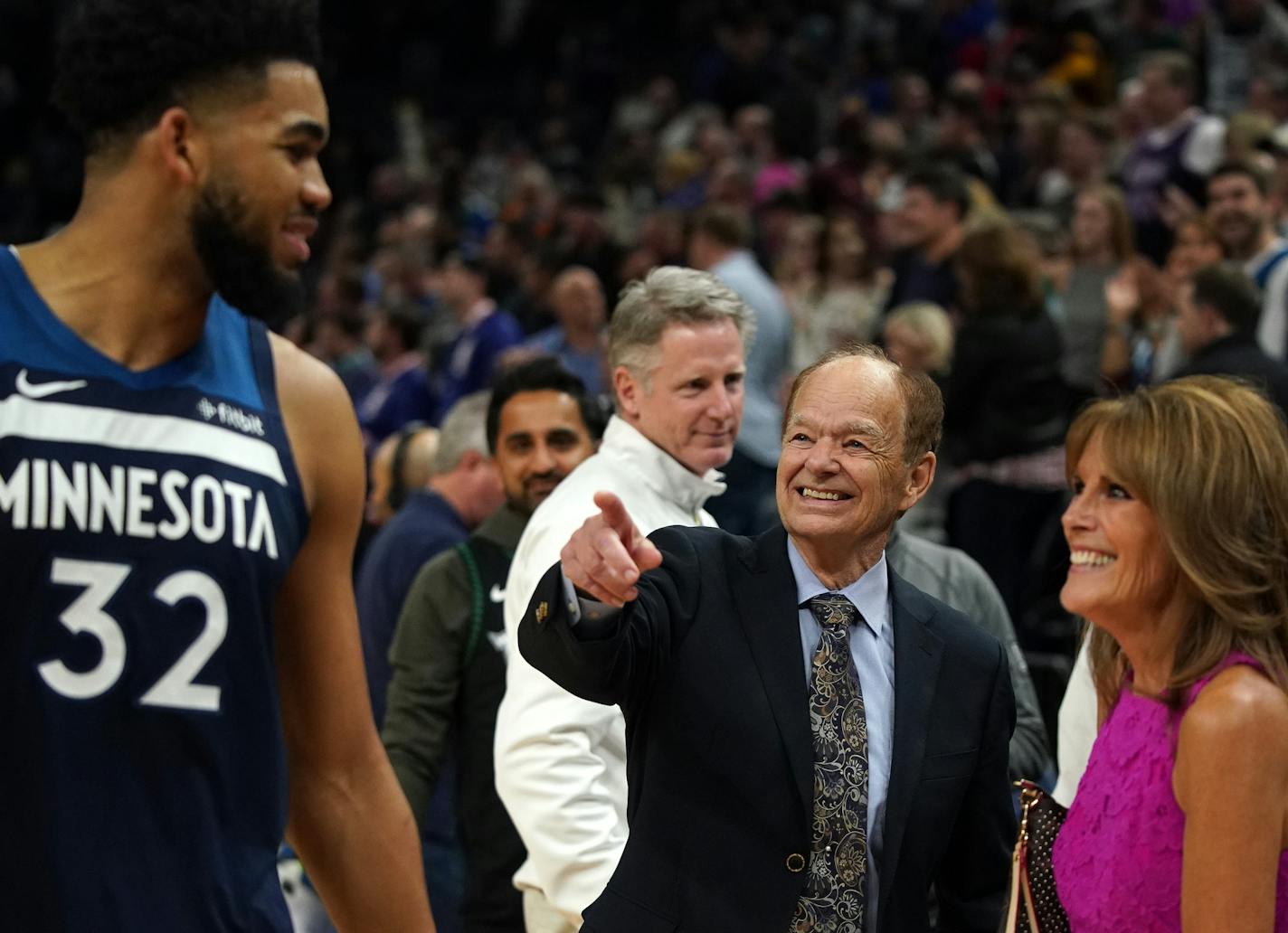 Timberwolves center Karl-Anthony Towns was congratulated by team owner Glen Taylor and his wife Becky after a win over the Golden State Warriors