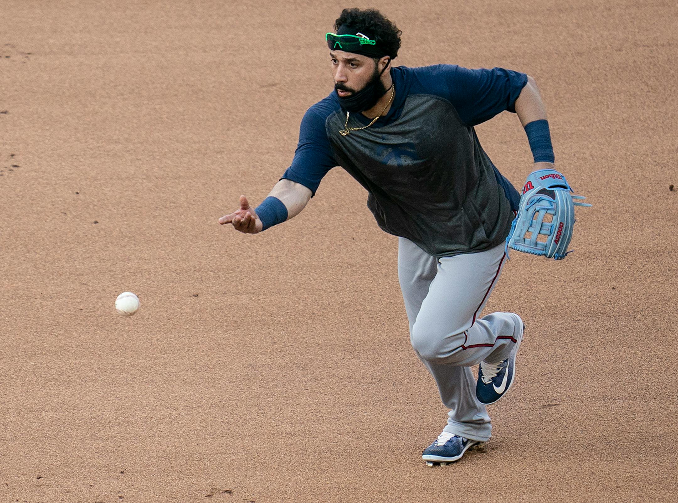 ]Minnesota Twins left fielder Marwin Gonzalez (9) passed the ball during a scrimmage at practice at Target Field in Minneapolis, Minn., on Wednesday, July 8, 2020.